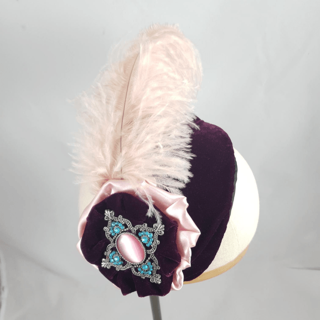 Fascinator bandeau à cocarde et plume d'autruche